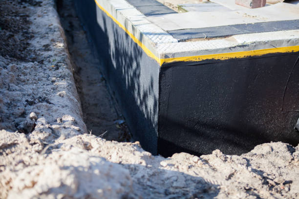 Professional Waterproofing technician working in Rosemount, MN